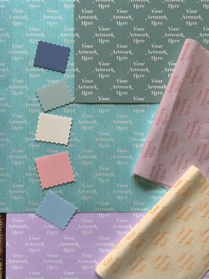 May include: A flat lay of different colored wrapping paper with a repeating pattern of the text "Your Artwork Here". The wrapping paper is in shades of blue, pink, beige, and yellow.
