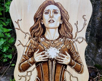 May include: Wood-burned portrait of a woman with long brown hair, wearing a brown and tan outfit. A bright light emanates from her chest, with lightning-like lines extending outward. The wooden plaque has a decorative, scalloped edge.