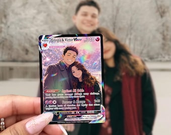May include: A custom trading card featuring an illustration of a couple in a snowy setting, titled Giorgia & Victor VMAX with 340 HP. The card includes the ability Against All Odds and the attack Forever & Always, with pink heart symbols and text.