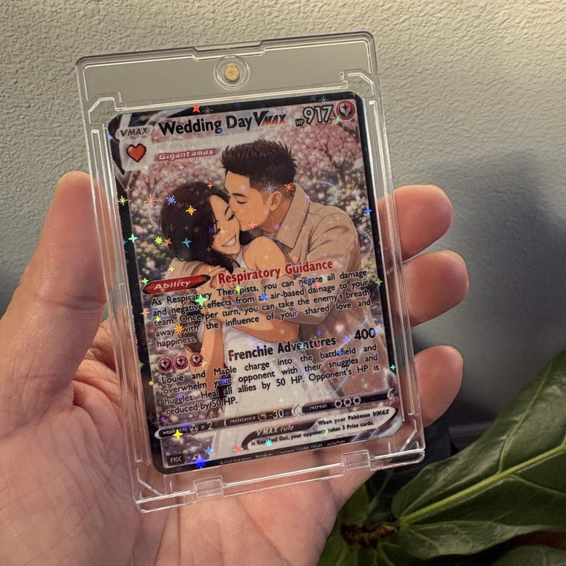 Custom holographic Pokémon-style metal trading card for a couple, displayed in a clear magnetic case and personalized with wedding artwork.