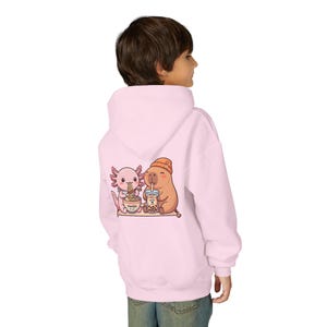 kid wearing pink Cozy kids hoodie kawaii animal friends boba ramen theme