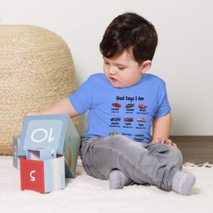 God Says I Am Toddler Tee | Toddler Christian Top | Faith-Based Kids Shirt | Bible Verse Tee for Toddlers | Inspirational Baby Gift