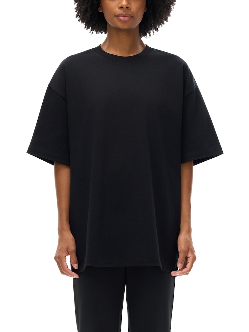 Heavyweight black drop shoulder t-shirt size chart with unisex measurements, 425 GSM cotton details, care instructions, and fit guide.