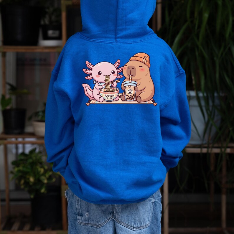 kid wearing royal blue Axolotl capybara kids hoodie kawaii ramen boba design