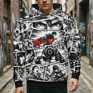 May include: Black and white manga-style hoodie featuring various panels with action poses and expressions. The hoodie has a black hood, cuffs, and hem. Red Japanese text accents the design. The overall theme is a comic book or graphic novel.