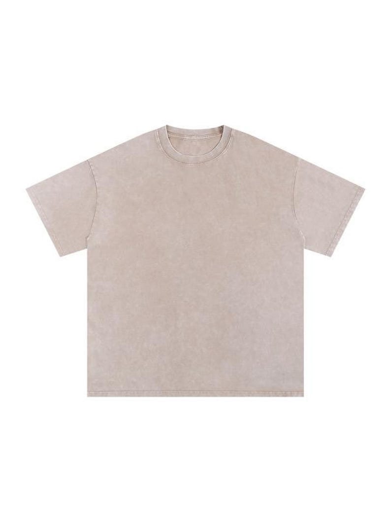 Flat-lay product view of a short-sleeve, neutral apricot acid wash oversized t-shirt against a plain white background.