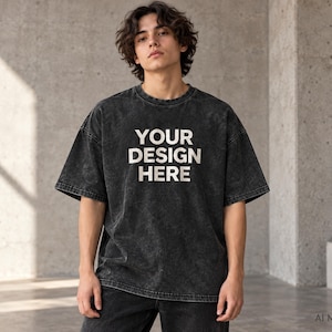 Model wearing a black custom acid wash oversized T-shirt with “Your Design Here” front print, heavyweight unisex streetwear tee.