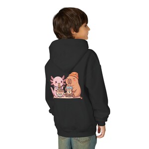 Kid wearing black Kawaii kids sweatshirt bubble tea ramen animal illustration