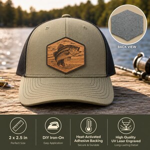 May include: An olive green baseball cap with a black mesh back and a hexagonal patch featuring a laser-engraved bass fish design. The patch measures 2 x 2.5 inches. The cap includes a heat-activated adhesive backing for iron-on application.