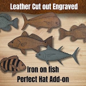 May include: Leather cut-out and engraved fish designs in various shades of brown and gray. The image includes text that reads "Iron on fish" and "Perfect Hat Add-on". These fish designs are suitable for adding to hats.