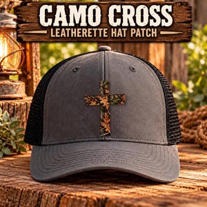 May include: A gray trucker hat featuring a black mesh back and a centered leatherette patch shaped like a cross with a camouflage leaf pattern. The text CAMO CROSS LEATHERETTE HAT PATCH is displayed above the hat in a wooden sign style.