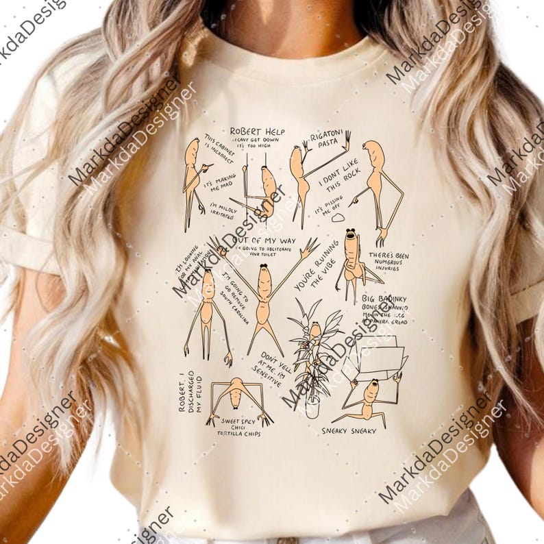 May include: Cream-colored t-shirt with a humorous cartoon design. The graphic features several stick figures with various expressions and speech bubbles, including phrases like "Robert Help" and "Sneaky Sneaky."