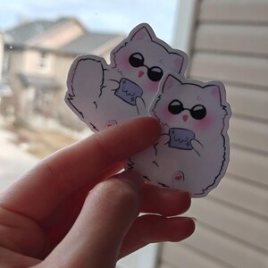 Chibi Gojo cat sticker with a cute fluffy design, dark sunglasses, and pastel colors. Inspired by Jujutsu Kaisen, this kawaii anime vinyl sticker is perfect for decorating water bottles, phone cases, journals, laptops, and more!