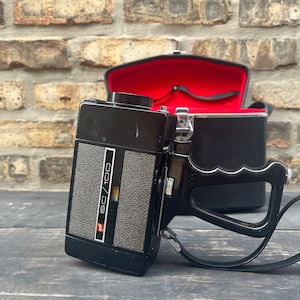 vintage 1960s 8 mm movie camera , gaf sc / 100 , hand held camera , Bell & Howell zoomatic , camera and case , vintage photography