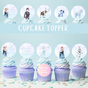 May include: Cupcakes with blue and purple icing, decorated with circular toppers featuring characters from the film Frozen. The text "CUPCAKE TOPPER" is displayed above the cupcakes. The cupcakes are decorated with sprinkles.