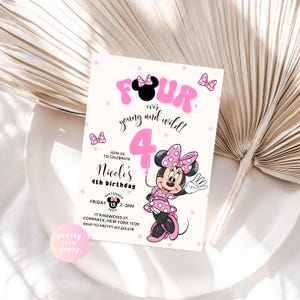 May include: A pink and white invitation card for a fourth birthday party. The card features the text "FOUR over young and wild!" and "Nicole's 4th birthday". A cartoon character is also featured on the card.