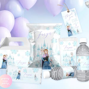 May include: Party supplies with a Frozen theme, including a gift box, treat bags, water bottles, and a candy bar wrapper. The designs feature Elsa and Anna, snowflakes, and the name "Freya". The colour scheme is light blue and purple.