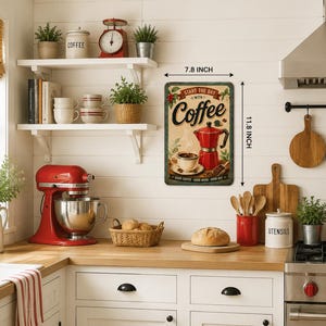 May include: A rectangular metal wall sign featuring a red moka pot, a cup of coffee, and the text "START THE DAY WITH COFFEE". The sign measures 7.8 inches by 11.8 inches and includes decorative green leaf accents and a dark border.