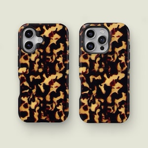 May include: Two smartphone cases featuring a tortoiseshell design. The cases have a black border and a repeating pattern of brown and tan shapes. They are designed to fit a smartphone and have cutouts for the camera and buttons.