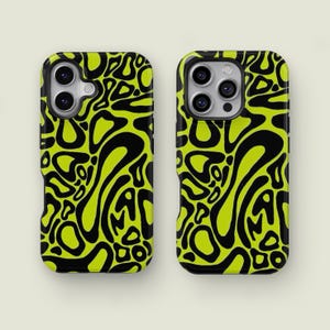 May include: Two phone cases with a striking, abstract pattern. The cases display a repeating design of black, organic shapes set against a bright, neon green backdrop. The cases have a glossy finish and are designed to fit a smartphone.