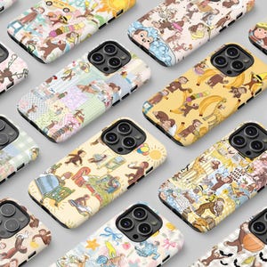 May include: A selection of phone cases with diverse, colourful patterns featuring cartoon monkeys. The cases have different backgrounds, including yellow, pink, and blue, with the monkey illustrations in various poses.