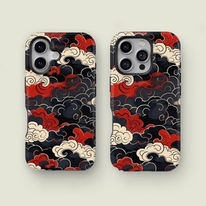 May include: Two smartphone cases featuring a repeating cloud pattern in red, black, and cream. The cases have a glossy finish and are designed for a smartphone. The cloud design is inspired by traditional Japanese art.
