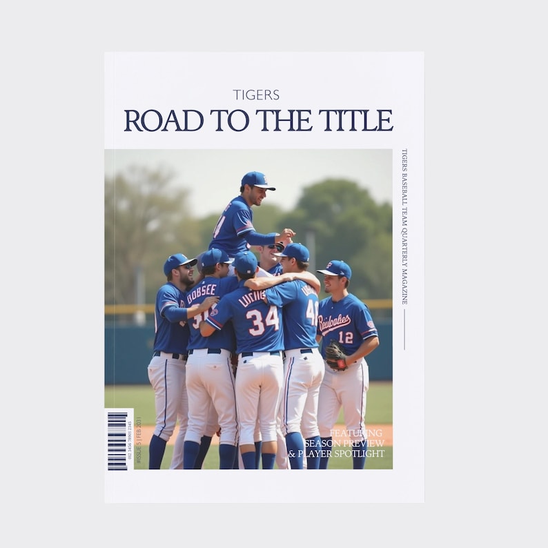 May include: A magazine cover with the headline "ROAD TO THE TITLE" and the word "TIGERS" at the top. The cover shows a baseball team in blue uniforms celebrating. Text on the cover includes "SEASON PREVIEW & PLAYER SPOTLIGHT".