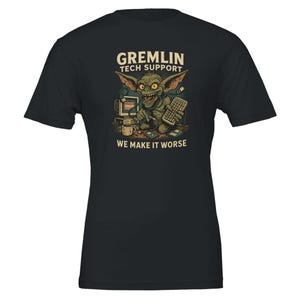 May include: Black t-shirt with a graphic of a gremlin at a computer, with the text "GREMLIN TECH SUPPORT" above and "WE MAKE IT WORSE" below. The gremlin is green with large ears and is holding a keyboard.
