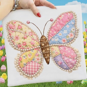 以下が含まれることがあります： パステルカラーのピンク、イエロー、ブルー、パープルなどのパッチワークの羽を持つ装飾的な蝶で、花柄が施されています。 蝶は茶色の体をしており、真珠のトリムで縁取られています。 羽は白い背景に取り付けられています。