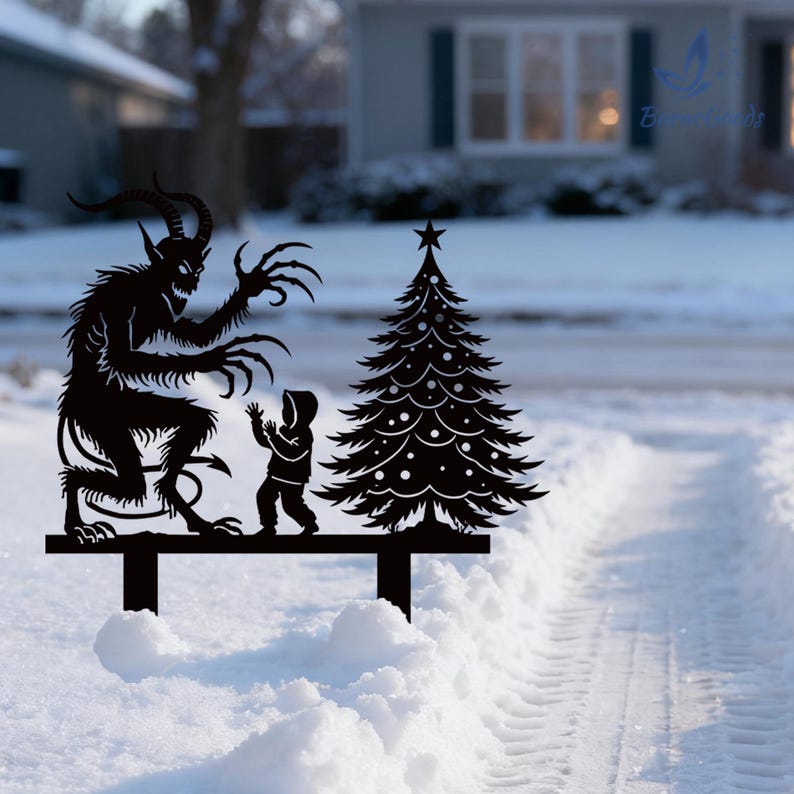 May include: Black metal yard art featuring a Krampus figure, a child, and a Christmas tree. The Krampus has horns and claws, and the child is reaching up. The tree has a star on top. The art is set in a snowy yard.
