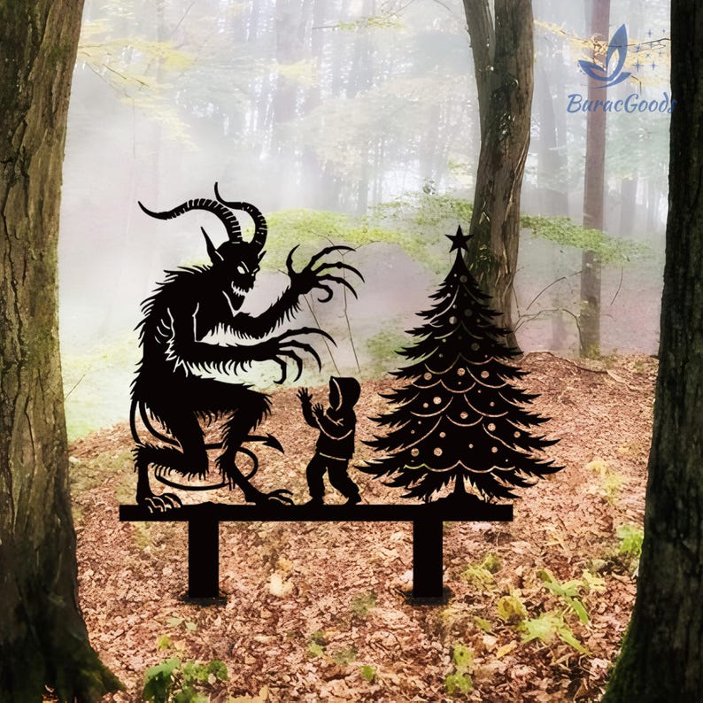 May include: Black metal yard art depicting a horned demon figure, a child, and a Christmas tree. The figures are silhouetted against a blurred forest background. The art piece is designed to be placed in a garden or yard.