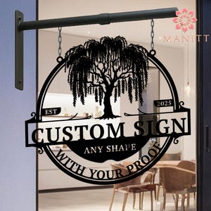 May include: Black metal custom sign with a weeping willow tree design. The sign is round with a rectangular banner that reads "CUSTOM SIGN" and "ANY SHAPE WITH YOUR PROOF". The sign is suspended by chains.