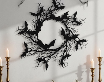 May include: A black metal Halloween wreath featuring a circular design of bare tree branches and bat silhouettes. The wreath is mounted on a white wall, with candles and pumpkins below, creating a spooky seasonal display.
