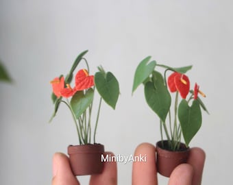 Miniature Anthurium Tailflower made from airdry clay in a terracotta pot