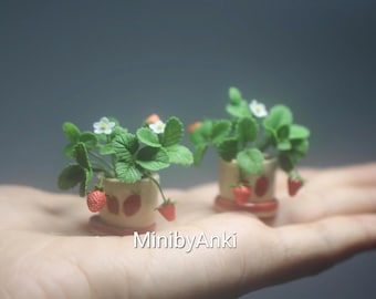Miniature strawberry plant made from airdry clay in ceramic pot