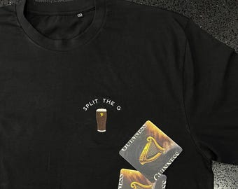 May include: Black t-shirt with the text "SPLIT THE G" and a graphic of a pint of Guinness. Two Guinness coasters are on the shirt.