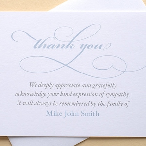 May include: A thank you card with a blue cursive font that reads "thank you". The card has a blue cursive design and the text "We deeply appreciate and gratefully acknowledge your kind expression of sympathy. It will always be remembered by the family of Mike John Smith."