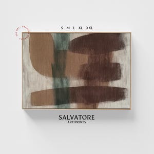 May include: Abstract art print with brown, beige, and green brushstrokes on a white background. The print is framed in a thin, gold frame. The text "SALVATORE ART PRINTS" is printed below the image.
