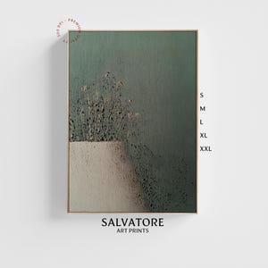May include: Abstract art print with a green and white color scheme. The print features a textured background with a white rectangle in the lower portion of the image. The print is framed in a light wood frame. The text "SALVATORE ART PRINTS" is printed below the image.