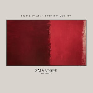 May include: Abstract painting with two shades of red, a darker red on the left and a lighter red on the right. The painting is framed in a black frame. The text "SALVATORE ART PRINTS" is below the painting.