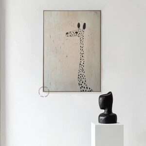 May include: A black and white abstract painting of a giraffe on a light beige background. The giraffe is facing left and has a long neck and a spotted pattern.