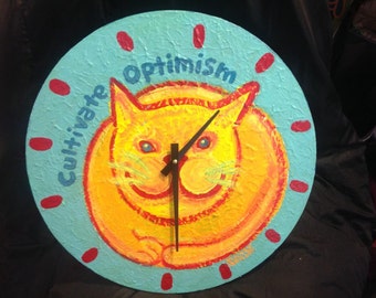 yellow cat clock Cultivate Optimism copyright Hillary Vermont