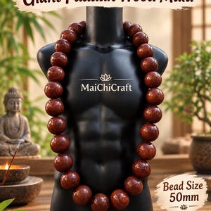 May include: A Giant Padauk Wood Mala necklace featuring large, round, reddish-brown wooden beads. The text on the image reads Giant Padauk Wood Mala, MaichiCraft, and Bead Size 50mm. The beads are displayed on a black mannequin torso.