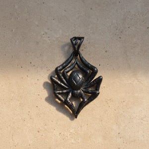 Black oxidized spider pendant with dramatic gunmetal finish, bold gothic tarantula jewelry with detailed leg texture for dark style