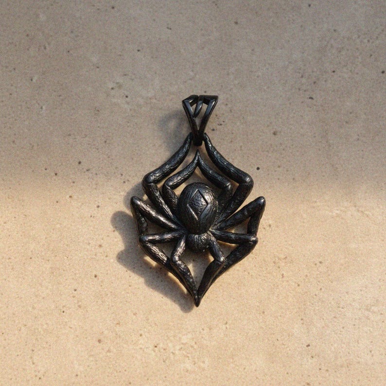 Black oxidized spider pendant with dramatic gunmetal finish, bold gothic tarantula jewelry with detailed leg texture for dark style