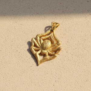 Spider pendant in 14k gold vermeil with textured body and legs creating web frame, handcrafted 925 sterling silver gothic arachnid jewelry
