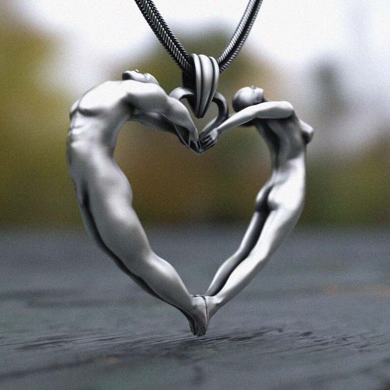 Artistic human form heart sculpture necklace in sterling silver