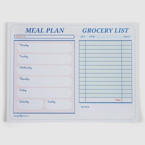 May include: A white meal plan and grocery list notepad with blue and pink accents. The notepad is divided into sections for meal planning, with days of the week listed, and a grocery list with columns for quantity, item, and price. The word "Total" is visible.