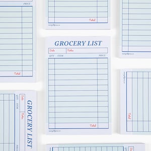 May include: A set of five blue and white grocery list notepad pages with the words "Grocery List" printed in red at the top of each page. Each page has columns for quantity, item, notes, and price. The bottom of each page has the word "Total" printed in red.