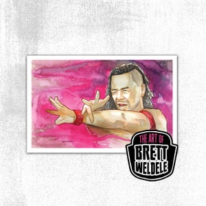May include: Watercolor art print featuring a man in a red wristband and top, striking a pose against a pink and purple background. The print includes the text "THE ART OF BRETT WELDELE" in a black and white logo.